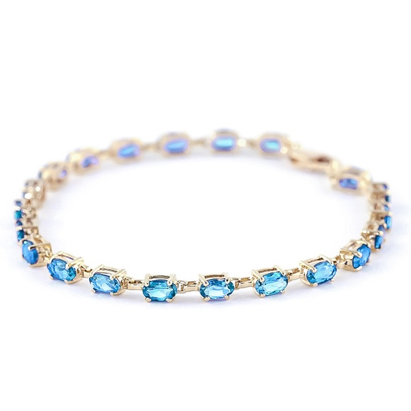 14K. SOLID GOLD TENNIS BRACELET WITH BLUE TOPAZ (Yellow gold) - Picture 2 of 4
